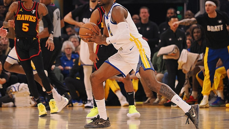 Jan 24, 2024; San Francisco, California, USA; Golden State Warriors forward Jonathan Kuminga (00) controls the ball against the Atlanta Hawks during the first quarter at Chase Center. Mandatory Credit: Kelley L Cox-USA TODAY Sports