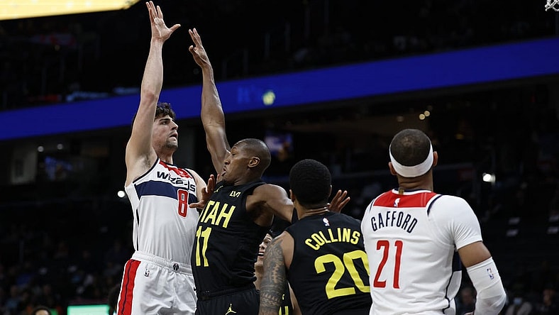 Jan 25, 2024; Washington, District of Columbia, USA; Washington Wizards forward Deni Avdija (8) shoots the ball over Utah Jazz guard Kris Dunn (11) in the first half at Capital One Arena. Mandatory Credit: Geoff Burke-USA TODAY Sports