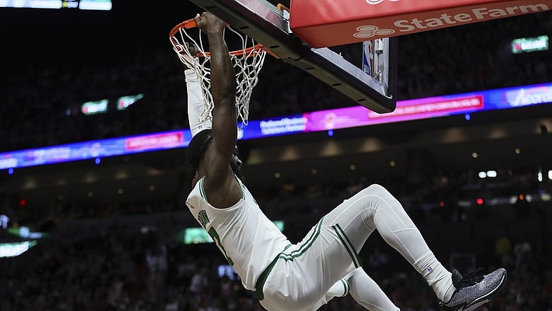 Jan 25, 2024; Miami, Florida, USA; Boston Celtics guard Jaylen Brown (7) dunks the basketball against the Miami Heat during the second quarter at Kaseya Center. Mandatory Credit: Sam Navarro-USA TODAY Sports
