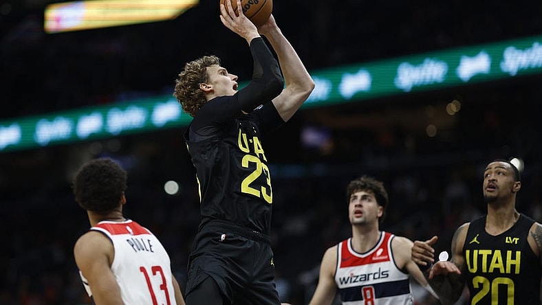 Jan 25, 2024; Washington, District of Columbia, USA; Utah Jazz forward Lauri Markkanen (23) shoots the ball as Washington Wizards forward Deni Avdija (8) looks on in the second half at Capital One Arena. Mandatory Credit: Geoff Burke-USA TODAY Sports