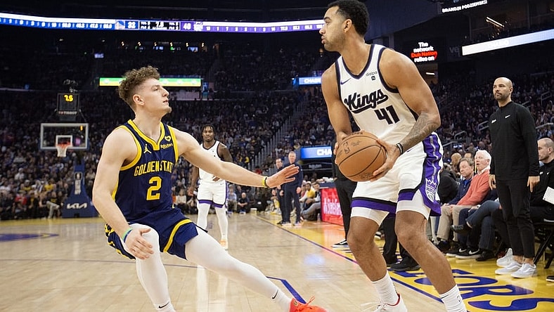 Jan 25, 2024; San Francisco, California, USA; Sacramento Kings forward Trey Lyles (41) looks to pass over Golden State Warriors guard Brandin Podziemski (2) during the first quarter at Chase Center. Mandatory Credit: D. Ross Cameron-USA TODAY Sports