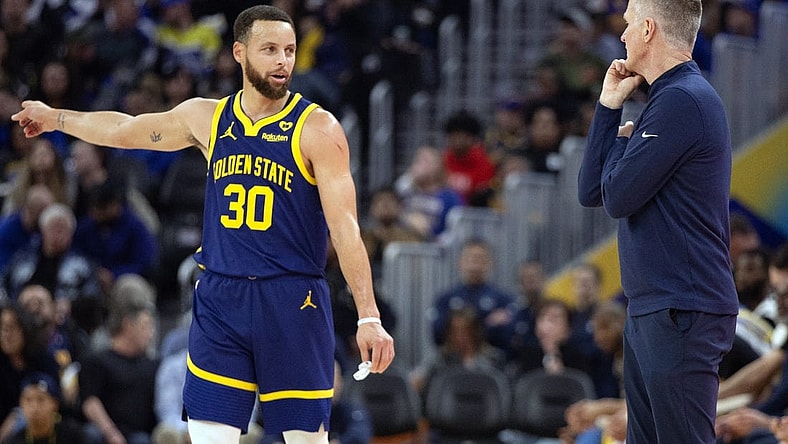 Jan 25, 2024; San Francisco, California, USA; Golden State Warriors guard Stephen Curry (30) consults with head coach Steve Kerr during the first quarter against the Sacramento Kings at Chase Center. Mandatory Credit: D. Ross Cameron-USA TODAY Sports