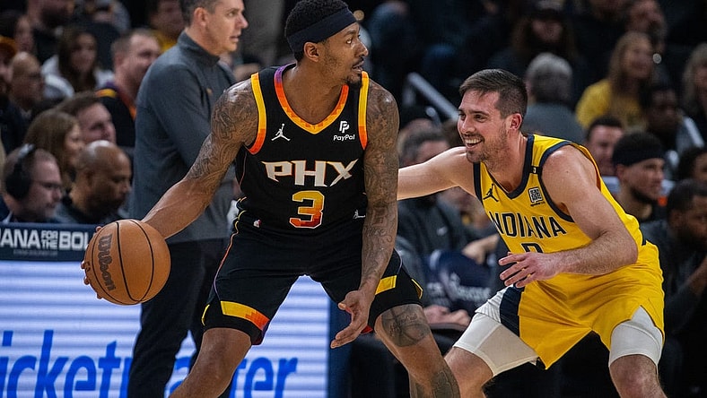 Jan 26, 2024; Indianapolis, Indiana, USA; Phoenix Suns guard Bradley Beal (3) dribbles the ball while Indiana Pacers guard T.J. McConnell (9) defends in the first half at Gainbridge Fieldhouse. Mandatory Credit: Trevor Ruszkowski-USA TODAY Sports