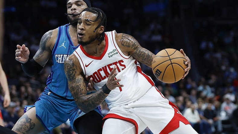 Jan 26, 2024; Charlotte, North Carolina, USA; Houston Rockets forward Cam Whitmore (7) moves against Charlotte Hornets forward Miles Bridges (0) during the second half at Spectrum Center. Mandatory Credit: Nell Redmond-USA TODAY Sports