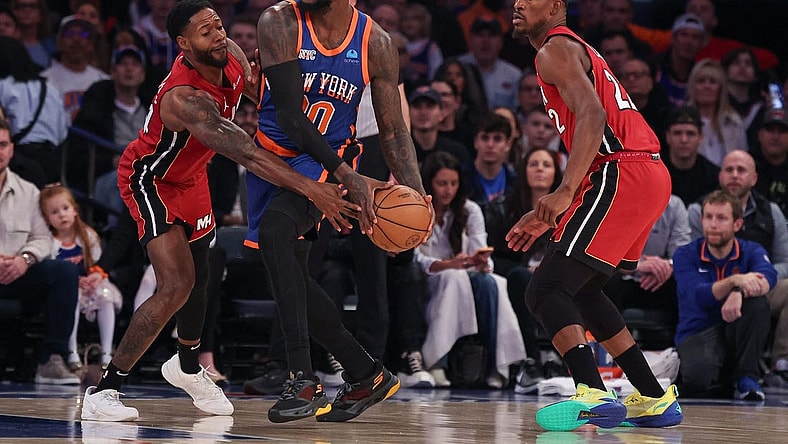 Jan 27, 2024; New York, New York, USA; New York Knicks forward Julius Randle (30) looks to pass as Miami Heat forward Haywood Highsmith (24) and forward Jimmy Butler (22) defend during the first half at Madison Square Garden. Mandatory Credit: Vincent Carchietta-USA TODAY Sports