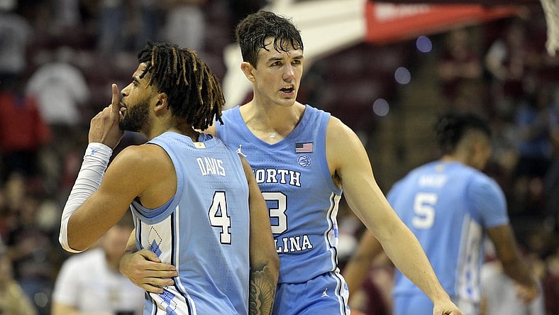 Jan 27, 2024; Tallahassee, Florida, USA; North Carolina Tarheels guard RJ Davis (4) and guard Cormac Ryan (3) celebrate after winning the game against the Florida State Seminoles at Donald L. Tucker Center. Mandatory Credit: Melina Myers-USA TODAY Sports
