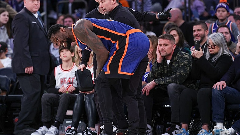 Jan 27, 2024; New York, New York, USA; New York Knicks forward Julius Randle (30) is helped by medical staff after an injury during the second half against the Miami Heat at Madison Square Garden. Mandatory Credit: Vincent Carchietta-USA TODAY Sports