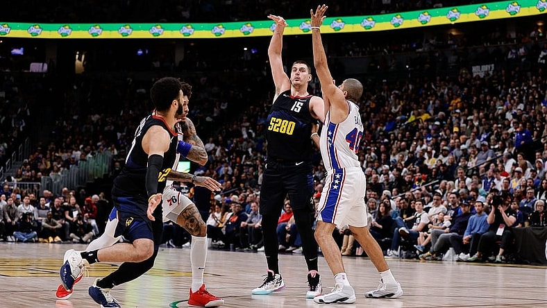 Jan 27, 2024; Denver, Colorado, USA; Denver Nuggets center Nikola Jokic (15) looks to pass the ball to guard Jamal Murray (27) as Philadelphia 76ers forward Nicolas Batum (40) and guard Kelly Oubre Jr. (9) defend in the second quarter at Ball Arena. Mandatory Credit: Isaiah J. Downing-USA TODAY Sports