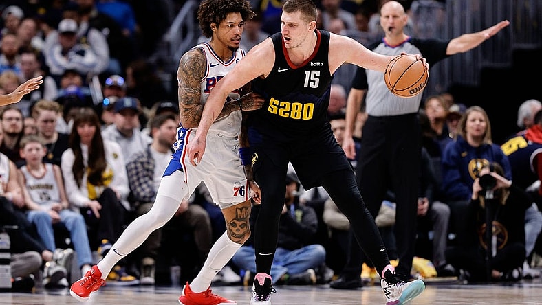 Jan 27, 2024; Denver, Colorado, USA; Denver Nuggets center Nikola Jokic (15) controls the ball as Philadelphia 76ers guard Kelly Oubre Jr. (9) guards in the third quarter at Ball Arena. Mandatory Credit: Isaiah J. Downing-USA TODAY Sports