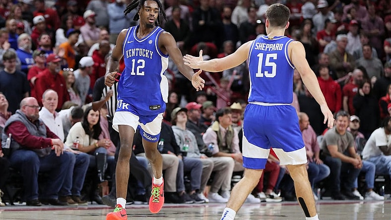 Jan 27, 2024; Fayetteville, Arkansas, USA; Kentucky Wildcats guard Antonio Reeves (12) celebrates with guard Reed Sheppard (15) after making a three point shot in the second half against the Arkansas Razorbacks at Bud Walton Arena. Kentucky won 63-57. Mandatory Credit: Nelson Chenault-USA TODAY Sports