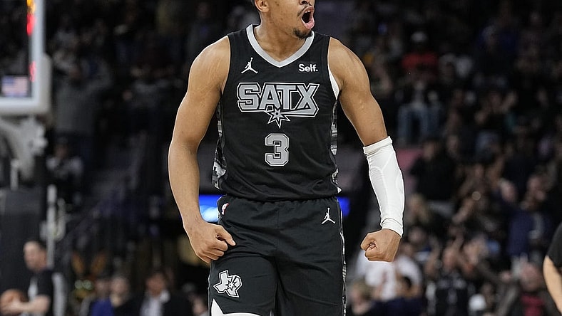Jan 27, 2024; San Antonio, Texas, USA; San Antonio Spurs forward Keldon Johnson (3) reacts after scoring a three point basket during the second half against the Minnesota Timberwolves at Frost Bank Center. Mandatory Credit: Scott Wachter-USA TODAY Sports