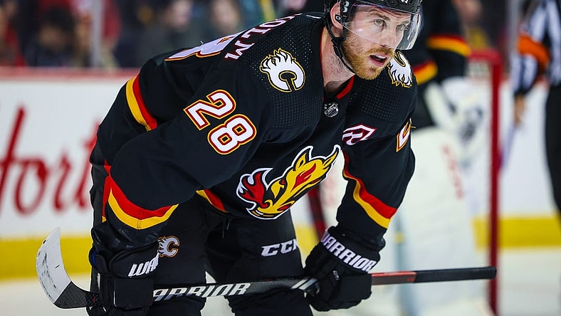 Jan 27, 2024; Calgary, Alberta, CAN; Calgary Flames center Elias Lindholm (28) during the face off against the Chicago Blackhawks during the third period at Scotiabank Saddledome. Mandatory Credit: Sergei Belski-USA TODAY Sports