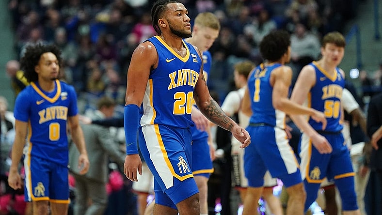 Jan 28, 2024; Hartford, Connecticut, USA; Xavier Musketeers guard Dayvion McKnight (20) and teammates head to the sideline as they take on the UConn Huskies in the first half at XL Center. Mandatory Credit: David Butler II-USA TODAY Sports