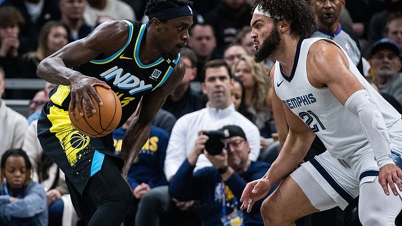 Jan 28, 2024; Indianapolis, Indiana, USA; Indiana Pacers forward Pascal Siakam (43) dribbles the ball while Memphis Grizzlies forward David Roddy (21) defends in the first half at Gainbridge Fieldhouse. Mandatory Credit: Trevor Ruszkowski-USA TODAY Sports