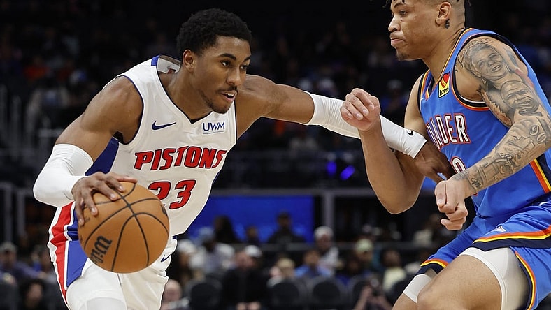 Jan 28, 2024; Detroit, Michigan, USA; Detroit Pistons guard Jaden Ivey (23) dribbles defended by Oklahoma City Thunder forward Keyontae Johnson (18) in the second half at Little Caesars Arena. Mandatory Credit: Rick Osentoski-USA TODAY Sports