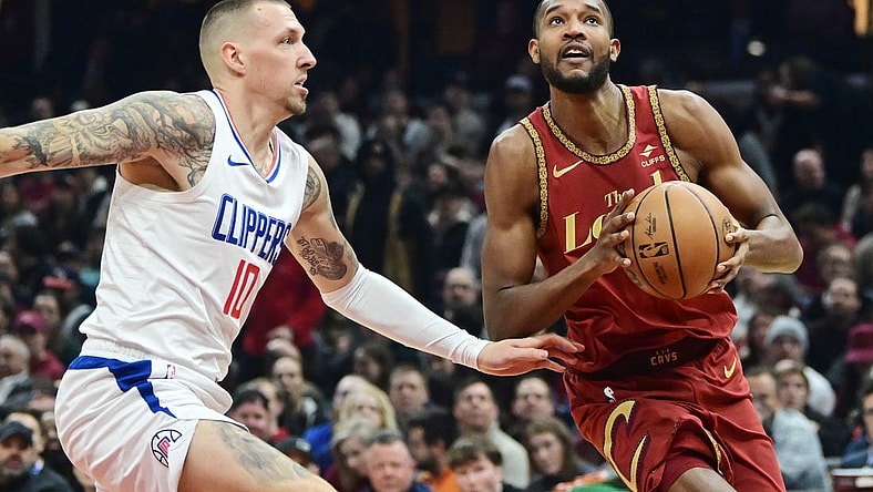 Jan 29, 2024; Cleveland, Ohio, USA; Cleveland Cavaliers forward Evan Mobley (4) drives to the basket against Los Angeles Clippers center Daniel Theis (10) during the first half at Rocket Mortgage FieldHouse. Mandatory Credit: Ken Blaze-USA TODAY Sports