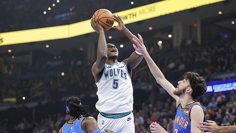 Jan 29, 2024; Oklahoma City, Oklahoma, USA; Minnesota Timberwolves guard Anthony Edwards (5) shoots as Oklahoma City Thunder forward Chet Holmgren (7) defends during the first quarter at Paycom Center. Mandatory Credit: Alonzo Adams-USA TODAY Sports