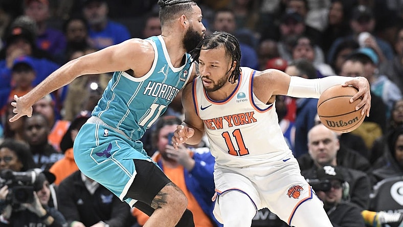 Jan 29, 2024; Charlotte, North Carolina, USA;  New York Knicks guard Jalen Brunson (11) moves into Charlotte Hornets forward Cody Martin (11) during the second half at the Spectrum Center. Mandatory Credit: Sam Sharpe-USA TODAY Sports