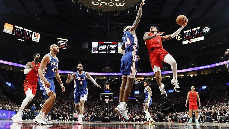 Jan 29, 2024; Portland, Oregon, USA; Portland Trail Blazers shooting guard Anfernee Simons (1) shoots the ball over Philadelphia 76ers small forward Paul Reed (44) during the first half at Moda Center. Mandatory Credit: Soobum Im-USA TODAY Sports