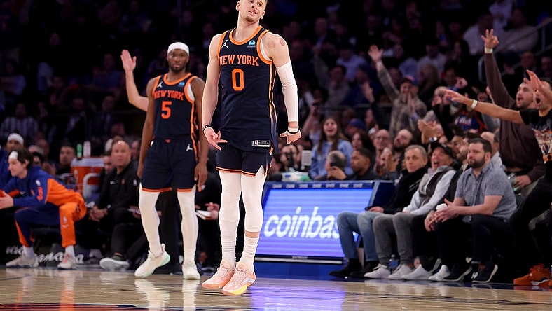 Jan 30, 2024; New York, New York, USA; New York Knicks guard Donte DiVincenzo (0) celebrates his three point shot against the Utah Jazz during the third quarter at Madison Square Garden. Mandatory Credit: Brad Penner-USA TODAY Sports