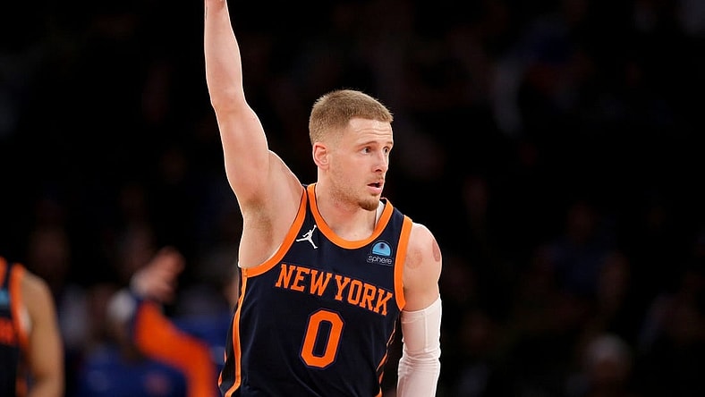 Jan 30, 2024; New York, New York, USA; New York Knicks guard Donte DiVincenzo (0) celebrates his three point shot against the Utah Jazz during the third quarter at Madison Square Garden. Mandatory Credit: Brad Penner-USA TODAY Sports