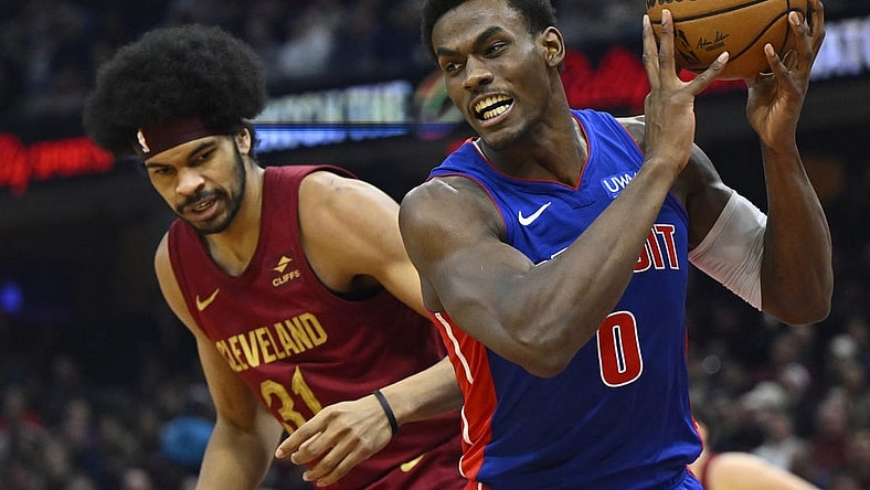 Jan 31, 2024; Cleveland, Ohio, USA; Detroit Pistons center Jalen Duren (0) controls the ball beside Cleveland Cavaliers center Jarrett Allen (31) in the second quarter at Rocket Mortgage FieldHouse. Mandatory Credit: David Richard-USA TODAY Sports