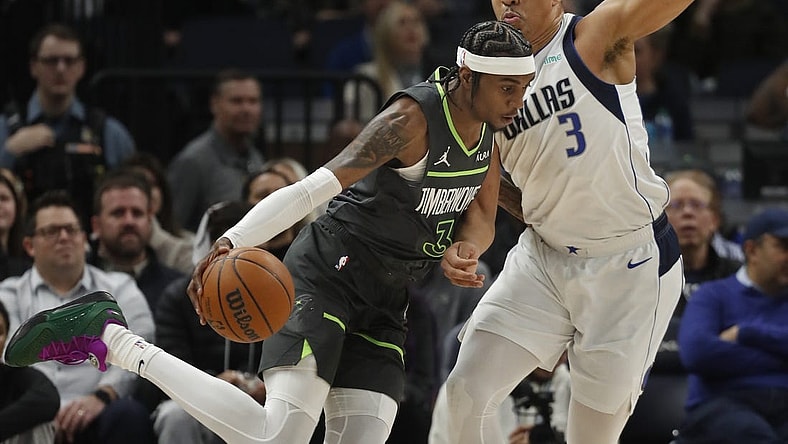 Jan 31, 2024; Minneapolis, Minnesota, USA; Minnesota Timberwolves forward Jaden McDaniels (3) works around Dallas Mavericks forward Grant Williams (3) in the first quarter at Target Center. Mandatory Credit: Bruce Kluckhohn-USA TODAY Sports