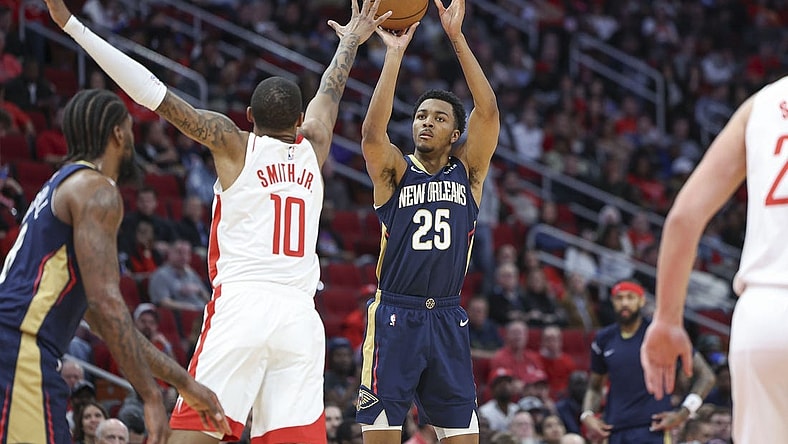 Jan 31, 2024; Houston, Texas, USA; New Orleans Pelicans guard Trey Murphy III (25) shoots the ball as Houston Rockets forward Jabari Smith Jr. (10) defends during the second quarter at Toyota Center. Mandatory Credit: Troy Taormina-USA TODAY Sports