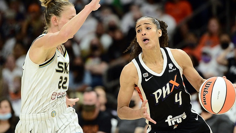 Oct 10, 2021; Phoenix, Arizona, USA; Phoenix Mercury guard Skylar Diggins-Smith (4) dribbles against Chicago Sky guard Courtney Vandersloot (22) during the first half of game one of the 2021 WNBA Finals at Footprint Center. Mandatory Credit: Joe Camporeale-USA TODAY Sports