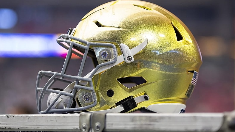 Jan 1, 2022; Glendale, Arizona, USA; Detailed view of a gold Notre Dame Fighting Irish helmet during the 2022 Fiesta Bowl at State Farm Stadium. Mandatory Credit: Mark J. Rebilas-USA TODAY Sports