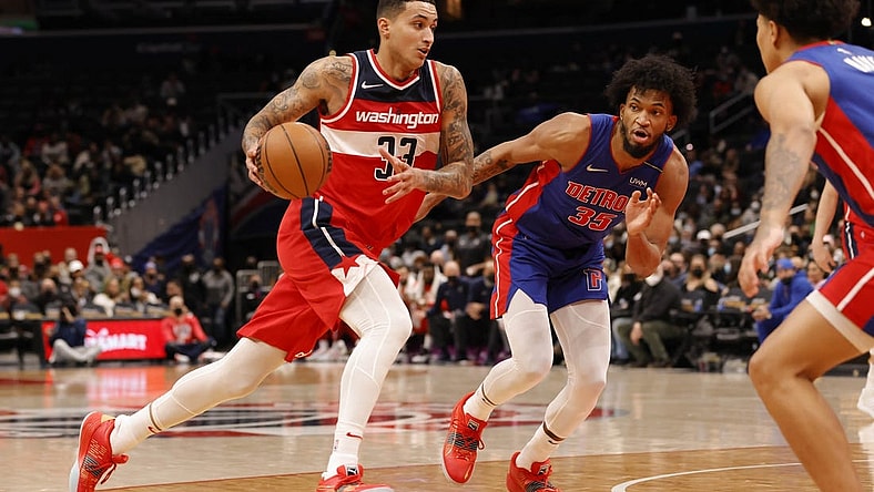 Feb 14, 2022; Washington, District of Columbia, USA; Washington Wizards forward Kyle Kuzma (33) drives to the basket past Detroit Pistons forward Marvin Bagley III (35) in the fourth quarter at Capital One Arena. Mandatory Credit: Geoff Burke-USA TODAY Sports