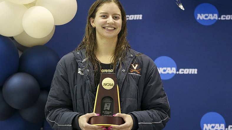 Mar 18, 2022; Atlanta, Georgia, USA; Virginia Cavaliers swimmer Kate Douglass holds a trophy after winning the 400 IM at the NCAA Swimming & Diving Championships at Georgia Tech. Mandatory Credit: Brett Davis-USA TODAY Sports