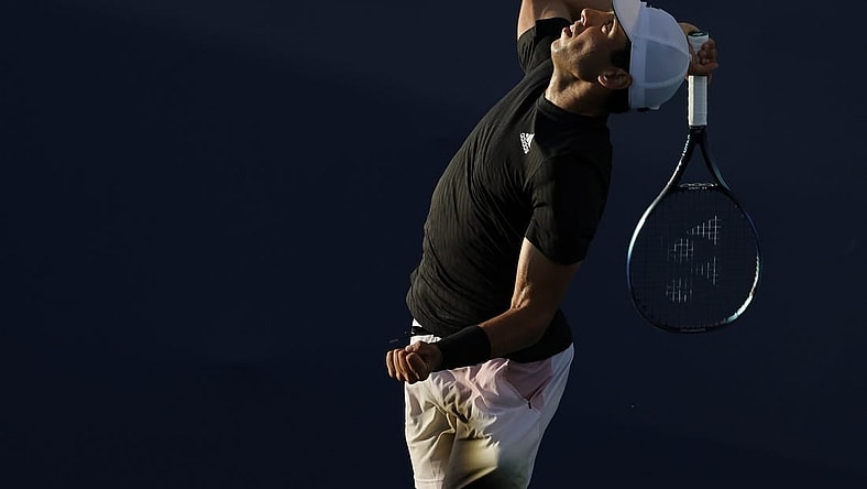 Mar 23, 2022; Miami Gardens, FL, USA; Jaume Munar (ESP) serves against Taro Daniel (JPN) (not pictured) in a first round men's singles match in the Miami Open at Hard Rock Stadium. Mandatory Credit: Geoff Burke-USA TODAY Sports