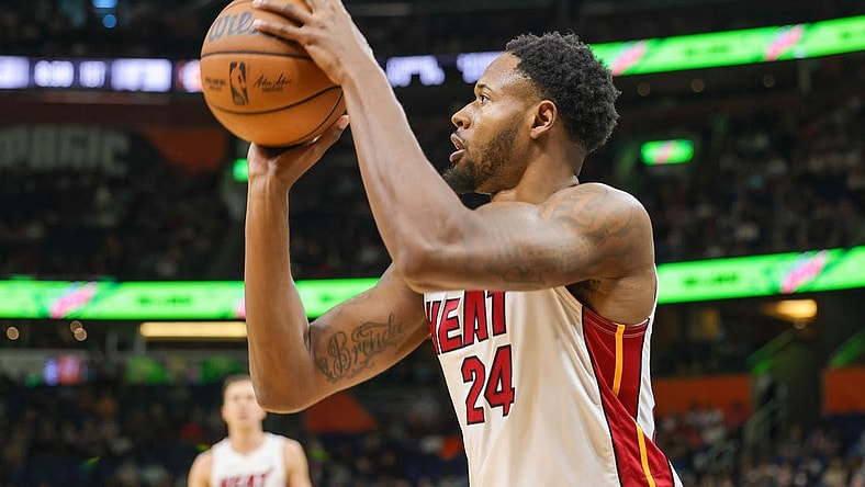 Apr 10, 2022; Orlando, Florida, USA; Miami Heat forward Haywood Highsmith (24) shoots a three-point basket against the Orlando Magic during the first quarter at Amway Center. Mandatory Credit: Mike Watters-USA TODAY Sports