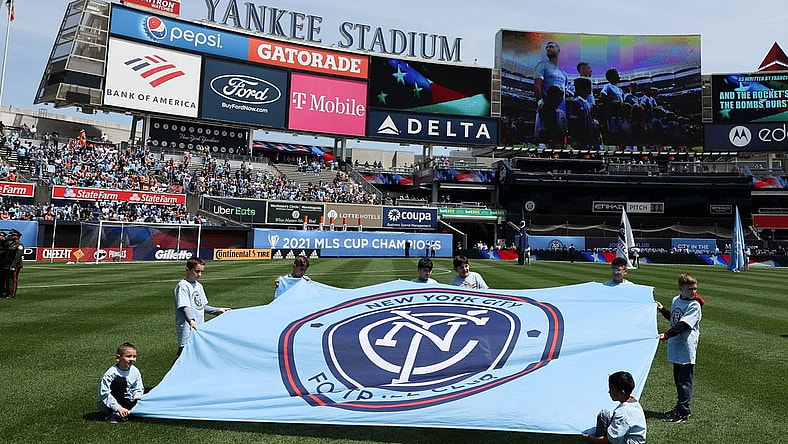 May 1, 2022; New York, New York, USA; Young fans hold a New York City FC banner on the pitch before the game against the San Jose Earthquakes at Yankee Stadium. Mandatory Credit: Vincent Carchietta-USA TODAY Sports