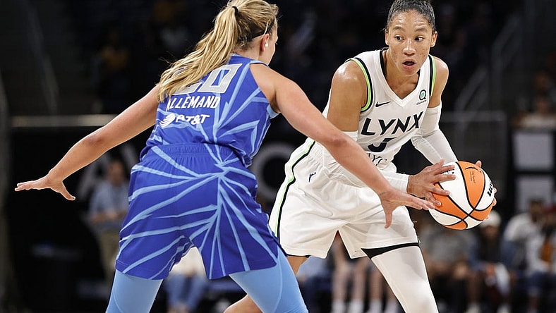 Jun 26, 2022; Chicago, Illinois, USA; Minnesota Lynx forward Aerial Powers (3) looks to pass the ball against Chicago Sky guard Julie Allemand (20) during the second half of a WNBA game at Wintrust Arena. Mandatory Credit: Kamil Krzaczynski-USA TODAY Sports