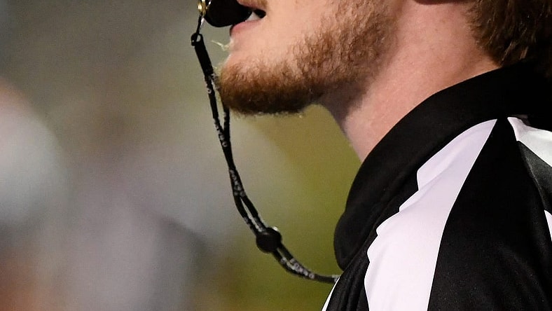 A referee blows the whistle during the Monterey-Abilene Wylie football game Thursday, Sept. 1, 2022, at PlainsCapital Park at Lowrey Field.