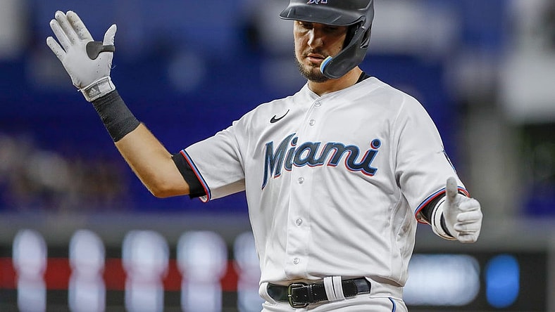 Sep 21, 2022; Miami, Florida, USA; Miami Marlins third baseman Jordan Groshans (65) reacts from first base after hitting a single during the third inning against the Chicago Cubs at loanDepot Park. Mandatory Credit: Sam Navarro-USA TODAY Sports