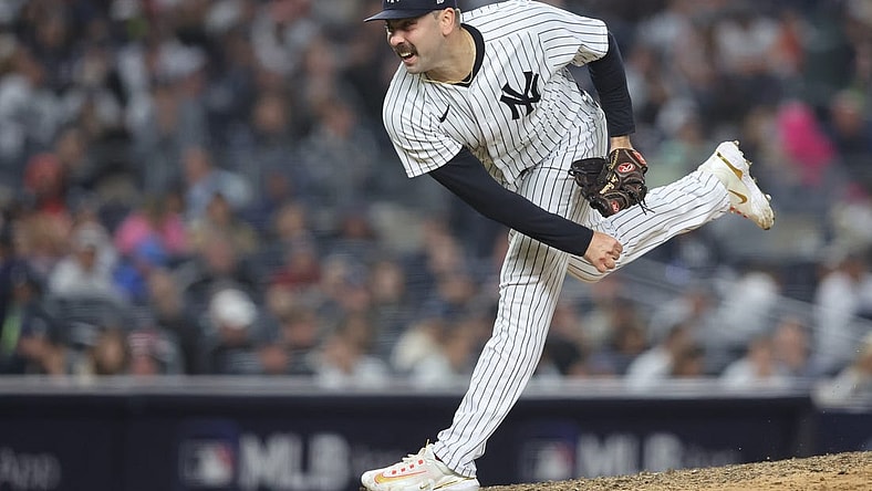Oct 22, 2022; Bronx, New York, USA;  New York Yankees relief pitcher Lou Trivino (56) pitches in the seventh inning against the Houston Astros during game three of the ALCS for the 2022 MLB Playoffs at Yankee Stadium. Mandatory Credit: Brad Penner-USA TODAY Sports