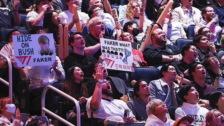 Nov 5, 2022; San Francisco, California, USA; Fans hold signs for T1 mid laner Lee "Faker" Sang-hyeok (not pictured) during the League of Legends World Championships against DRX at Chase Center. Mandatory Credit: Kelley L Cox-USA TODAY Sports