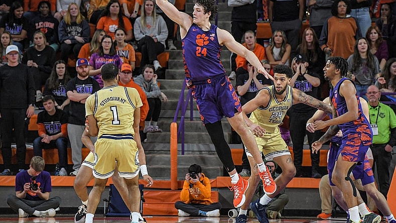 Jan 24, 2023; Clemson, South Carolina, USA; Clemson Tigers center PJ Hall (24) defends against Georgia Tech Yellow Jackets guard Kyle Sturdivant (1) during the second half at Littlejohn Coliseum. Mandatory Credit: Ken Ruinard-USA TODAY Sports