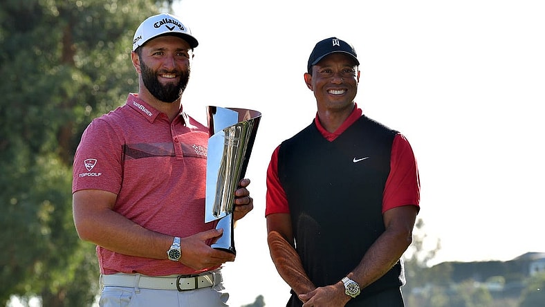 Feb 19, 2023; Pacific Palisades, California, USA; Jon Rahm poses for photos with Tiger Woods following his victory in the final round of The Genesis Invitational golf tournament. Mandatory Credit: Gary A. Vasquez-USA TODAY Sports