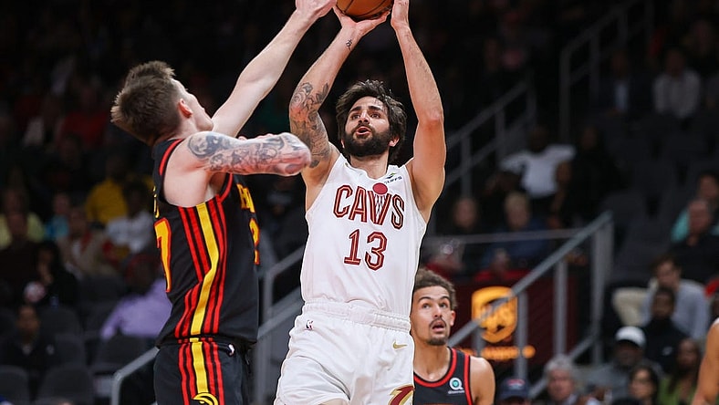 Mar 28, 2023; Atlanta, Georgia, USA; Cleveland Cavaliers guard Ricky Rubio (13) shoots over Atlanta Hawks guard Vit Krejci (27) in the second quarter at State Farm Arena. Mandatory Credit: Brett Davis-USA TODAY Sports