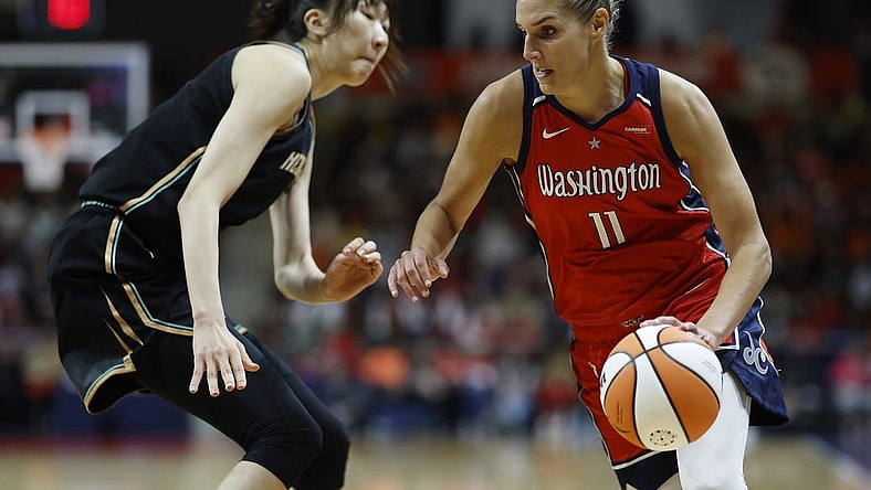 May 19, 2023; Washington, District of Columbia, USA; Washington Mystics forward Elena Delle Donne (11) drives to the basket as New York Liberty center Han Xu (21) defends in the fourth quarter at Entertainment & Sports Arena. Mandatory Credit: Geoff Burke-USA TODAY Sports