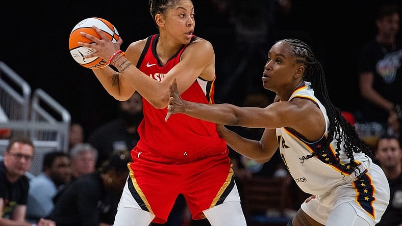 Jun 4, 2023; Indianapolis, Indiana, USA; Las Vegas Aces forward Candace Parker (3) looks to pass the ball while Indiana Fever center Queen Egbo (4) defends in the first half at Gainbridge Fieldhouse. Mandatory Credit: Trevor Ruszkowski-USA TODAY Sports