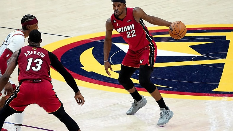 Jun 12, 2023; Denver, Colorado, USA; Miami Heat forward Jimmy Butler (22) dribbles during the fourth quarter of game five of the 2023 NBA Finals against the Denver Nuggets at Ball Arena. Mandatory Credit: Ron Chenoy-USA TODAY Sports