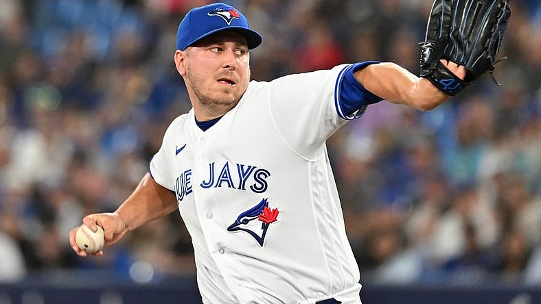 Jun 23, 2023; Toronto, Ontario, CAN;   Toronto Blue Jays relief pitcher Erik Swanson (50) delivers a pitch against the Oakland Athletics in the eighth inning at Rogers Centre. Mandatory Credit: Dan Hamilton-USA TODAY Sports