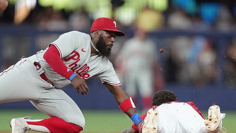 Jul 8, 2023; Miami, Florida, USA; Philadelphia Phillies second baseman Josh Harrison (2) tags out Miami Marlins center fielder Dane Myers (54) at second base in the first inning at loanDepot Park. Mandatory Credit: Jim Rassol-USA TODAY Sports