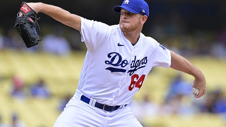 Aug 19, 2023; Los Angeles, California, USA;  Los Angeles Dodgers pitcher Caleb Ferguson (64) throws to the plate in the first inning against the Miami Marlins at Dodger Stadium. Mandatory Credit: Jayne Kamin-Oncea-USA TODAY Sports