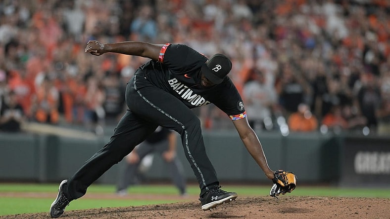 Aug 25, 2023; Baltimore, Maryland, USA; Baltimore Orioles relief pitcher Felix Bautista (74) slips while throwing a ninth inning pitch against the Colorado Rockies  at Oriole Park at Camden Yards. Mandatory Credit: Tommy Gilligan-USA TODAY Sports